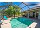 Inviting screened pool area with ample seating, perfect for relaxing and enjoying the outdoors at 4462 La France Ave, North Port, FL 34286