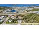 Expansive aerial view showing the home's location near a neighborhood, roadway, and the water at 4520 Knollwood Dr, Punta Gorda, FL 33982
