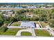 Aerial view of home with privacy fence, shed, and a curved driveway entrance at 4520 Knollwood Dr, Punta Gorda, FL 33982