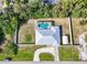 Aerial view of home showcasing a screened pool, fenced yard, shed, and curved driveway at 4520 Knollwood Dr, Punta Gorda, FL 33982