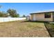 Spacious backyard featuring a shed, a well-maintained privacy fence, and a clear blue sky at 4520 Knollwood Dr, Punta Gorda, FL 33982