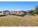 Wide-open backyard featuring a shed, patio furniture, and a screened-in pool area at 4520 Knollwood Dr, Punta Gorda, FL 33982