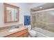 Bathroom features granite countertops, wood cabinets, and tiled shower at 4520 Knollwood Dr, Punta Gorda, FL 33982