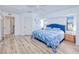 Comfortable bedroom with a large bed, and lots of natural light at 4520 Knollwood Dr, Punta Gorda, FL 33982