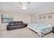Spacious bedroom with leather sofa, tile flooring, and plenty of sunlight at 4520 Knollwood Dr, Punta Gorda, FL 33982