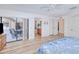 Light-filled bedroom with sliding glass doors to the patio and a view to the bathroom at 4520 Knollwood Dr, Punta Gorda, FL 33982