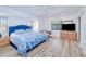 Bright bedroom with a large bed, wood floors, and ample natural light at 4520 Knollwood Dr, Punta Gorda, FL 33982