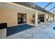 Outdoor patio area is covered, overlooking the screened in pool area and tropical landscaping at 4520 Knollwood Dr, Punta Gorda, FL 33982