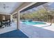 The screened-in pool area features a large pool and an outdoor dining area at 4520 Knollwood Dr, Punta Gorda, FL 33982