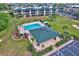 Aerial view of complex with a community pool, cabana and lounge area at 601 Shreve St # 13A, Punta Gorda, FL 33950
