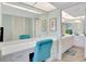 Vanity area with ample storage and counter space leading into bright bathroom at 601 Shreve St # 13A, Punta Gorda, FL 33950