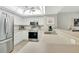 Bright kitchen with stainless steel appliances and white cabinets at 601 Shreve St # 13A, Punta Gorda, FL 33950