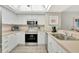 Modern kitchen with stainless steel appliances and white cabinets at 601 Shreve St # 13A, Punta Gorda, FL 33950