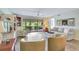 Bright living room with hardwood floors and sliding glass doors to screened lanai at 601 Shreve St # 13A, Punta Gorda, FL 33950