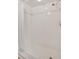 White-tiled shower featuring chrome fixtures and a shower curtain at 601 Shreve St # 13A, Punta Gorda, FL 33950