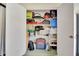 Organized storage closet with shelves and various household items at 601 Shreve St # 13A, Punta Gorda, FL 33950