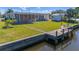 The property features a dock, a shed, and a screened lanai at 120 Buckeye Nw Ave, Port Charlotte, FL 33952