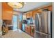 Bright kitchen with granite countertops, stainless steel appliances, and a convenient pass-through window at 120 Buckeye Nw Ave, Port Charlotte, FL 33952