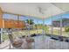 The screened lanai is perfect for enjoying outdoor living and waterfront views at 120 Buckeye Nw Ave, Port Charlotte, FL 33952