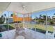 The screened lanai features tile flooring and overlooks the canal at 120 Buckeye Nw Ave, Port Charlotte, FL 33952