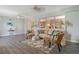 Living room with gray floors, ceiling fans, comfortable seating, large window and view of dining area at 120 Buckeye Nw Ave, Port Charlotte, FL 33952