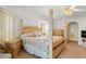 Large bedroom featuring light wood furniture, a ceiling fan and neutral carpeting at 1251 Partridge Dr, Punta Gorda, FL 33950