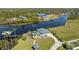 Stunning waterfront property boasting lush landscaping, a private dock, and picturesque canal views in a serene setting at 13000 Windcrest Dr, Port Charlotte, FL 33953