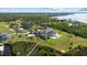 Luxury estate with a pool, lush landscaping, and a waterfront location, offering both privacy and picturesque views at 13000 Windcrest Dr, Port Charlotte, FL 33953