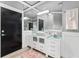 Bathroom features a stylish vanity with a vessel sink, a large mirror, and modern finishes at 13000 Windcrest Dr, Port Charlotte, FL 33953