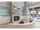 Comfortable living room featuring a stone fireplace and a view of the pool at 13000 Windcrest Dr, Port Charlotte, FL 33953