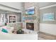 Open-concept living space with a stone fireplace and serene views at 13000 Windcrest Dr, Port Charlotte, FL 33953