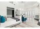 Open main bedroom with soaring ceilings, an ensuite wet bar, and seamless access to the outdoors at 13000 Windcrest Dr, Port Charlotte, FL 33953