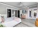 This bedroom offers access to an en suite bathroom and walk-in closet for added convenience at 13000 Windcrest Dr, Port Charlotte, FL 33953