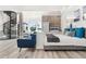 Luxurious main bedroom with spiral staircase and hide-away TV at the foot of the bed at 13000 Windcrest Dr, Port Charlotte, FL 33953