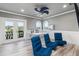 Office space includes a desk, three chairs, a ceiling fan, and a view of the exterior at 13000 Windcrest Dr, Port Charlotte, FL 33953