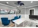 Bright office space with modern furniture, dual monitors and ceiling fan at 13000 Windcrest Dr, Port Charlotte, FL 33953