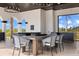 Covered outdoor dining with views of the surrounding greenery at 13000 Windcrest Dr, Port Charlotte, FL 33953