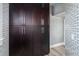 Pantry with dark wood cabinets and subway tile walls at 13000 Windcrest Dr, Port Charlotte, FL 33953