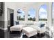 Bright sitting area with large arched windows and comfortable seating at 13000 Windcrest Dr, Port Charlotte, FL 33953