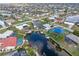 Waterfront community aerial view, boasting picturesque canals and beautiful homes with pools at 1301 Appian Dr, Punta Gorda, FL 33950