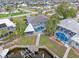 Aerial view of the home with a pool, dock, and canal access at 1301 Appian Dr, Punta Gorda, FL 33950