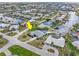 Aerial view of a beautiful waterfront home, featuring tropical landscaping and a pool at 1301 Appian Dr, Punta Gorda, FL 33950