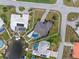 Aerial view of a home featuring a pool, landscaping, and waterfront access at 1301 Appian Dr, Punta Gorda, FL 33950