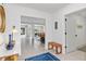 Bright entryway leading into an open floor plan, showcasing stylish decor and seamless transition between spaces at 1301 Appian Dr, Punta Gorda, FL 33950