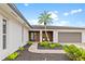 Well maintained single story home with tropical landscaping and attached garage at 1301 Appian Dr, Punta Gorda, FL 33950