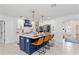 Kitchen island with seating and pendant lights, with modern cabinetry and appliances at 1301 Appian Dr, Punta Gorda, FL 33950