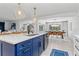 Island with seating, modern cabinetry, and stainless steel appliances at 1301 Appian Dr, Punta Gorda, FL 33950