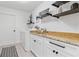 Laundry room featuring washer, dryer, shelves, and sink with granite countertop at 1301 Appian Dr, Punta Gorda, FL 33950