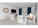 Bright living room with a large window, white sofa, decor accents, and modern furnishings at 1301 Appian Dr, Punta Gorda, FL 33950