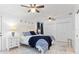 Bright bedroom with a queen bed, neutral rug, and double closets, creating a cozy and functional space at 1301 Appian Dr, Punta Gorda, FL 33950